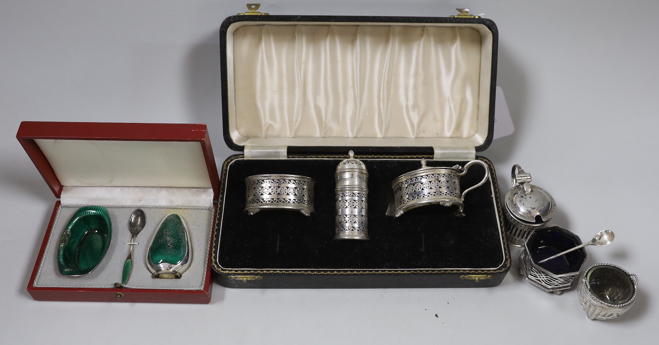 A modern cased silver three piece condiment set, a similar Danish enamelled sterling set (a.f.) and three other condiments including Chinese.